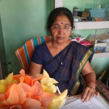 Principal Ma'am signing some important documents.